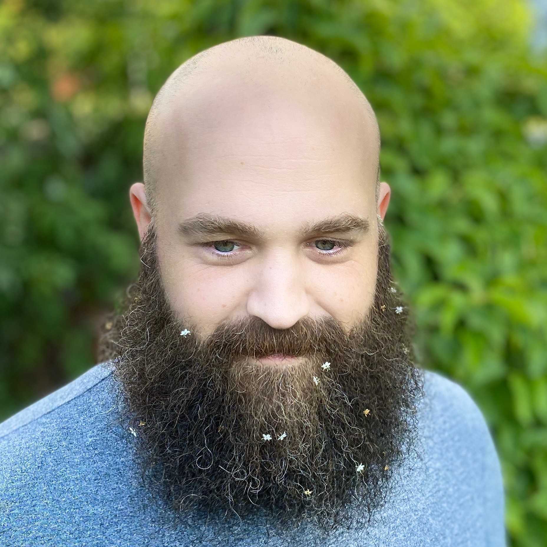 A photo of otherjosh with tiny flowers in his beard